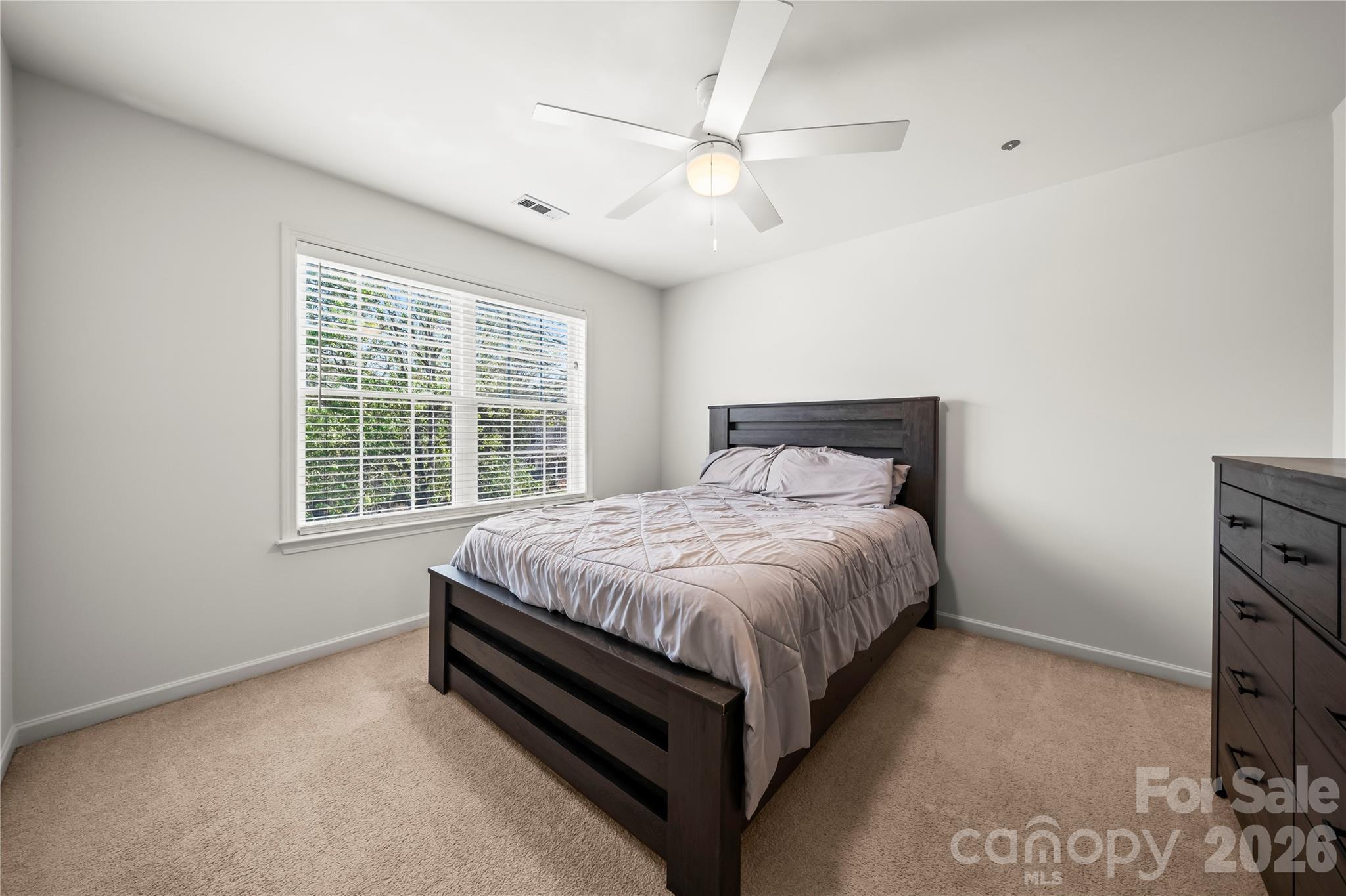 3715 Messina Road Clover, SC 29710 - Photo 21 of 33 a bed sitting in a spacious bedroom next to a window