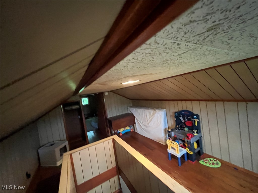 9355 Dozer Ridge Road Blue Rock, OH 43720 - Photo 14 of 23 Additional living space with lofted ceiling and wood walls
