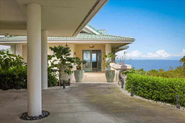 a view of a porch with potted plants