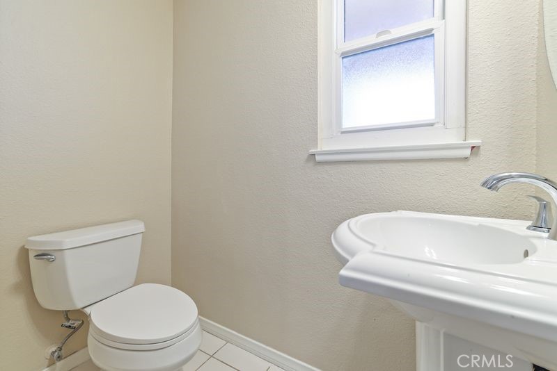 14802 Springford Drive La Mirada, CA 90638 - Photo 17 of 26 a white toilet sitting next to a white sink