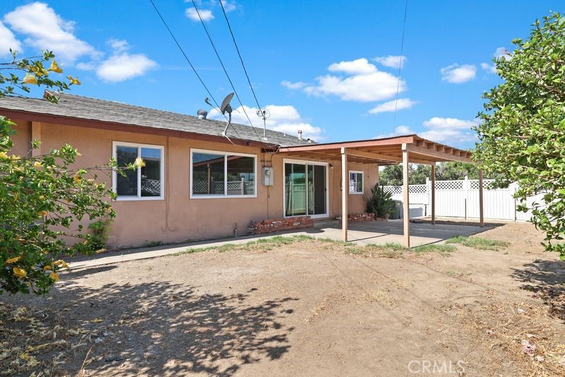 14802 Springford Drive La Mirada, CA 90638 - Photo 21 of 26 a backyard of a house with table and chairs