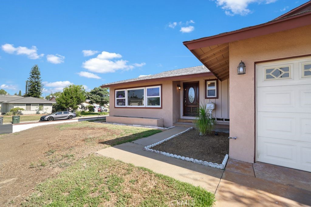 14802 Springford Drive La Mirada, CA 90638 - Photo 4 of 26 a front view of a house with garden