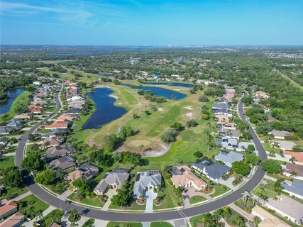 an aerial view of residential house with outdoor space and swimming pool