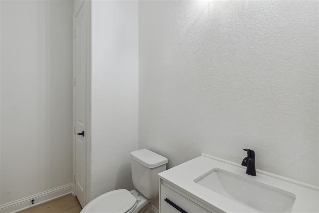 3737 Nottingham The Colony, TX 75056 - Photo 16 of 34 a white toilet sitting next to a white sink