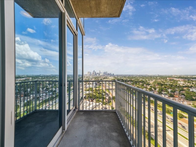 5925 Almeda Road, Unit 11901 Houston, TX 77004 - Photo 7 of 36 Take in sweeping panoramic views stretching across Houston from your private balcony. Whether you're enjoying morning coffee, entertaining friends, or unwinding after a long day, this outdoor space offers a front-row seat to the city's impressive skyline.