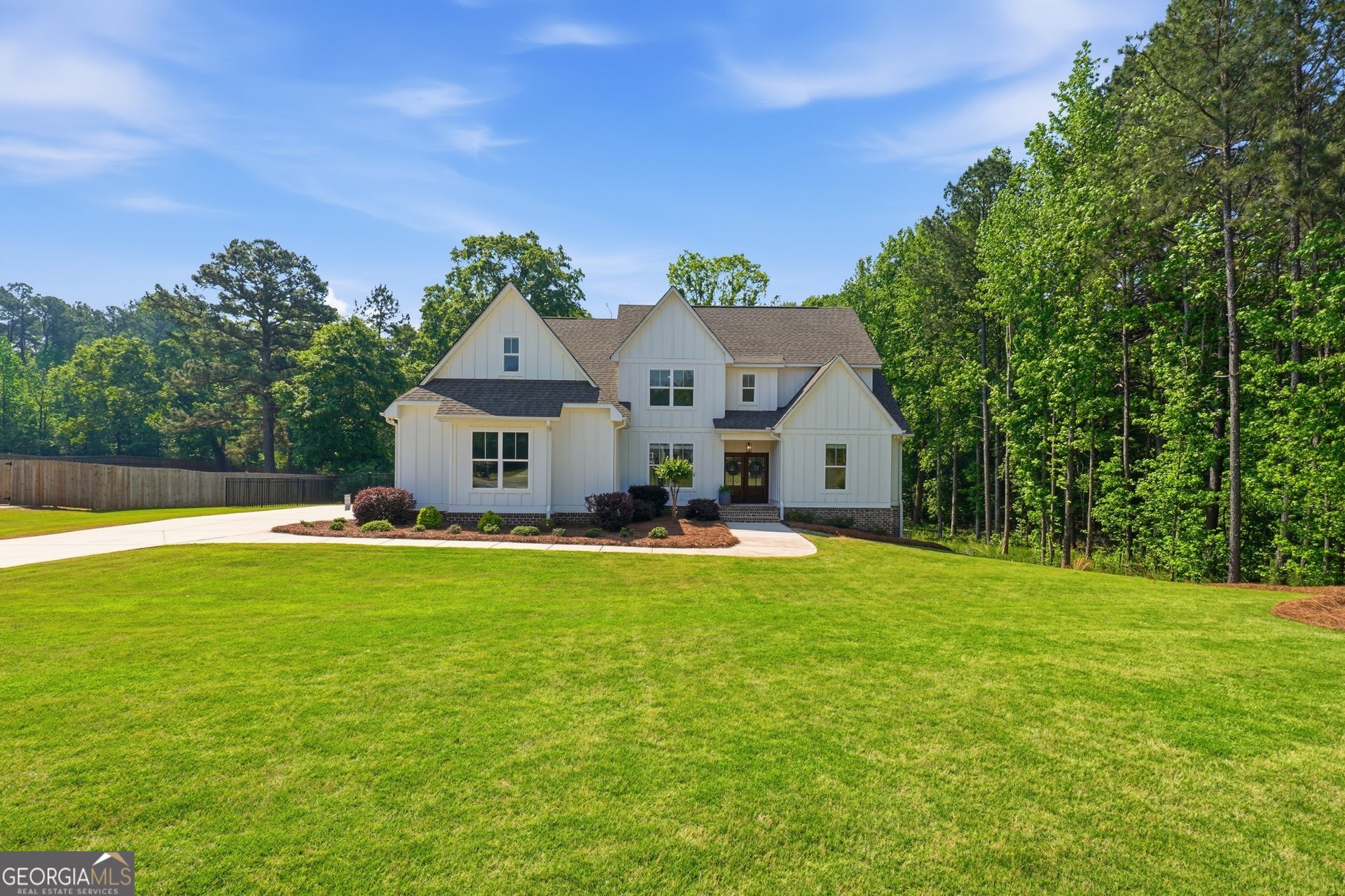 113 Kenmare Row Tyrone, GA 30290 - Photo 3 of 61 a front view of a house with a garden and porch