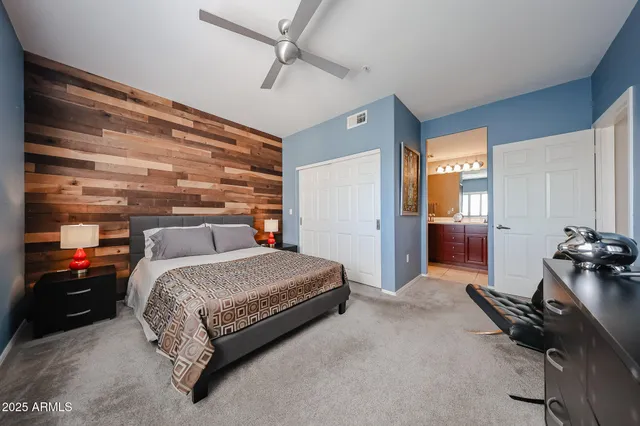 a bedroom with a bed and a dresser