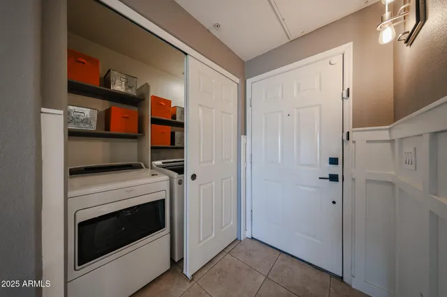 a utility room with closet dryer and washer