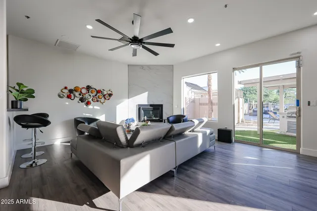 a living room with furniture and a large window