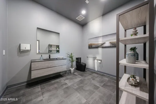 a bathroom with a double vanity sink and a mirror