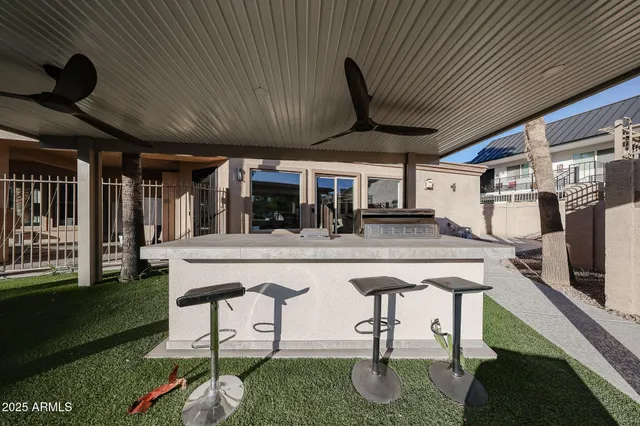 a view of a swimming pool with a table and chairs
