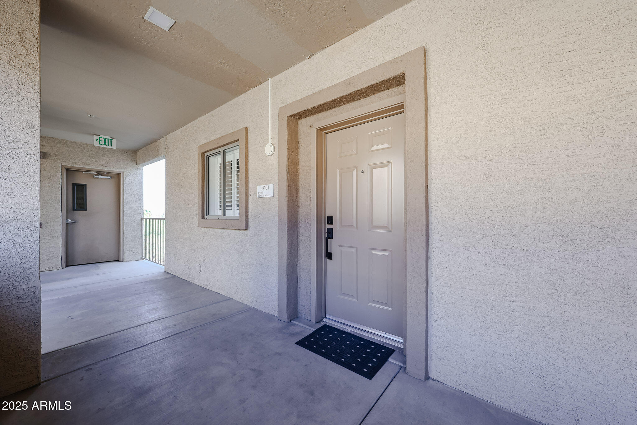 920 East Devonshire Avenue, Unit 4001 Phoenix, AZ 85014 - Photo 5 of 38 an empty room with windows and closet