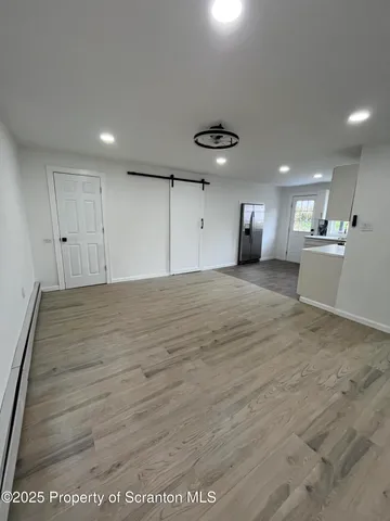 a view of a kitchen with a dishwasher and cabinets