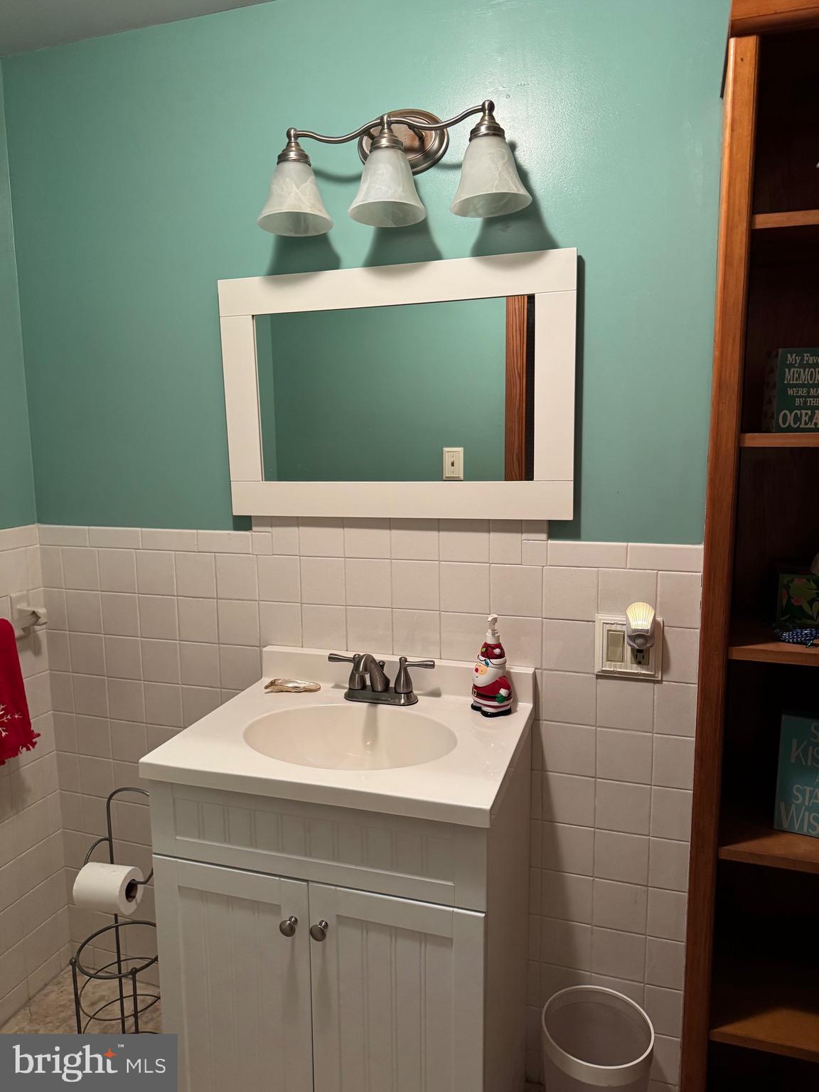 323 West 4th Street Florence, NJ 08518 - Photo 8 of 15 a bathroom with a sink and a mirror