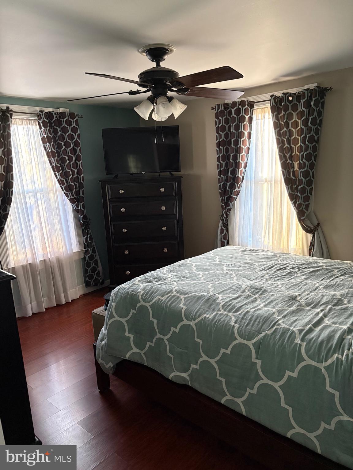 323 West 4th Street Florence, NJ 08518 - Photo 10 of 15 a bedroom with a bed and a flat tv screen