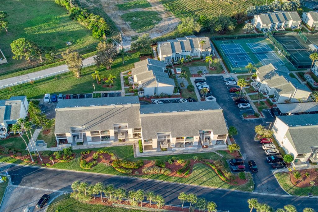 14800 Walsingham Road, Unit 213 Largo, FL 33774 - Photo 1 of 1 an aerial view of a house with a garden