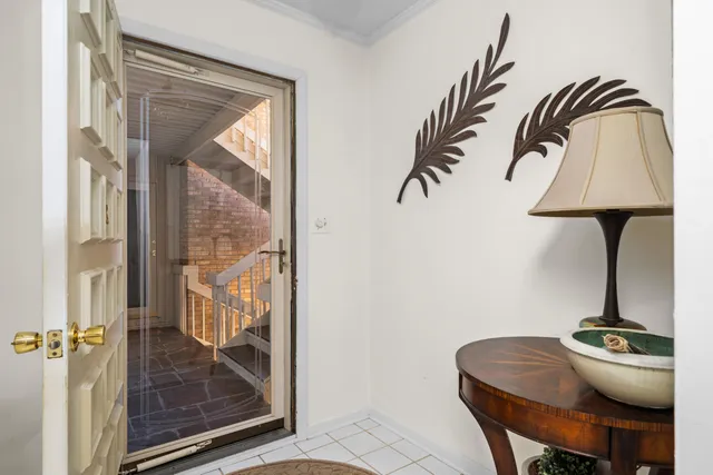 a dining room with furniture and entryway