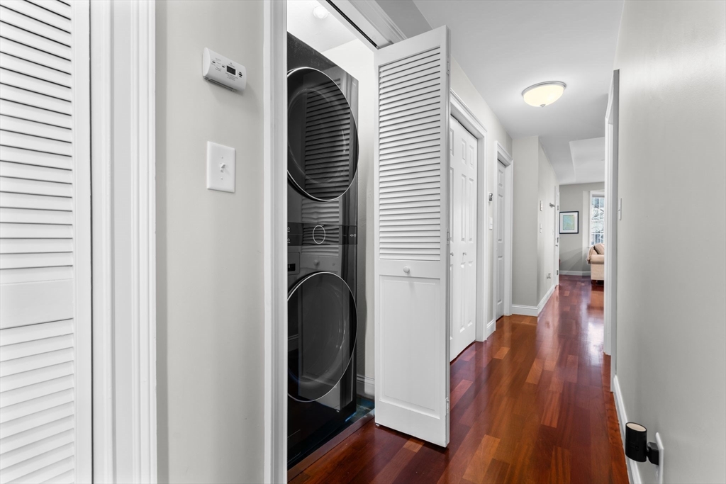 34 H Street, Unit 2L Boston, MA 02127 - Photo 11 of 20 a view of a hallway with wooden floor and staircase