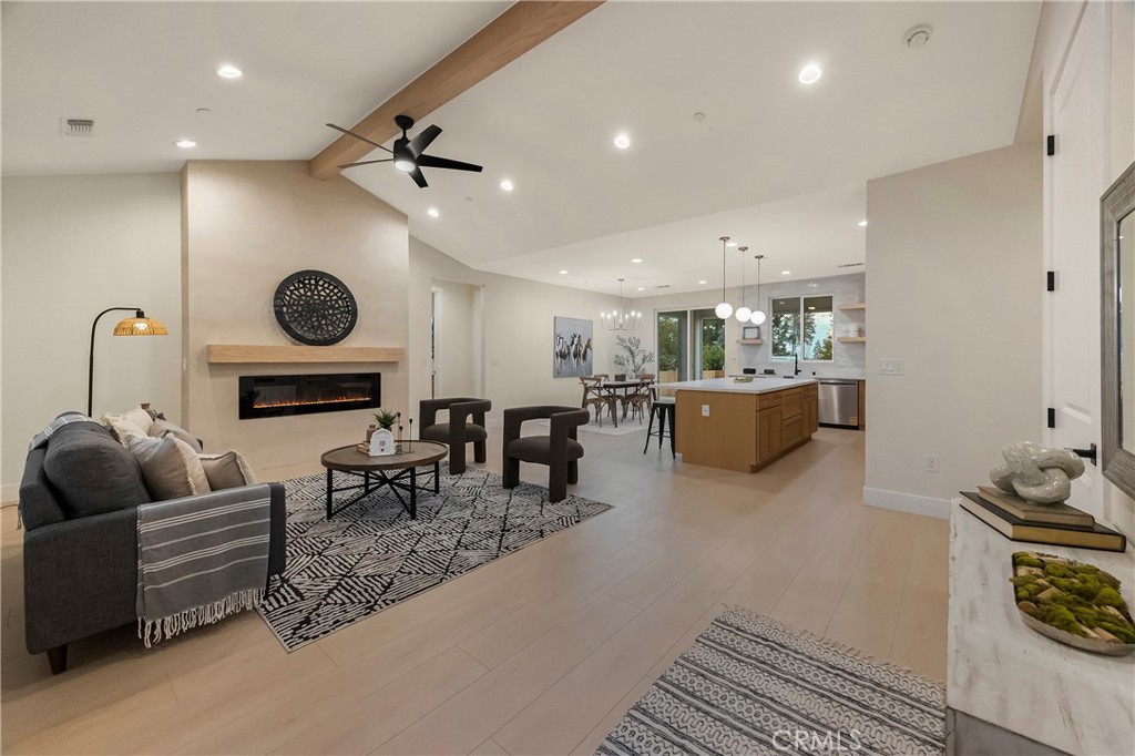 1560 Elliott Road Paradise, CA 95969 - Photo 13 of 50 a living room with furniture a rug kitchen view and a fireplace