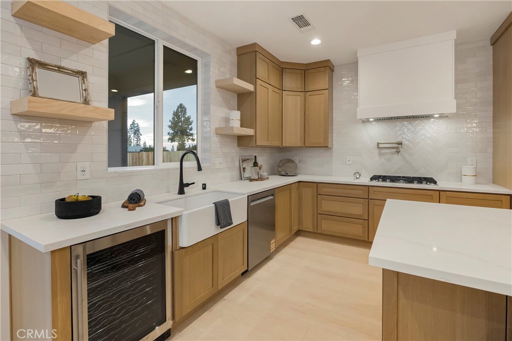 1560 Elliott Road Paradise, CA 95969 - Photo 17 of 50 a kitchen with stainless steel appliances a sink stove and cabinets