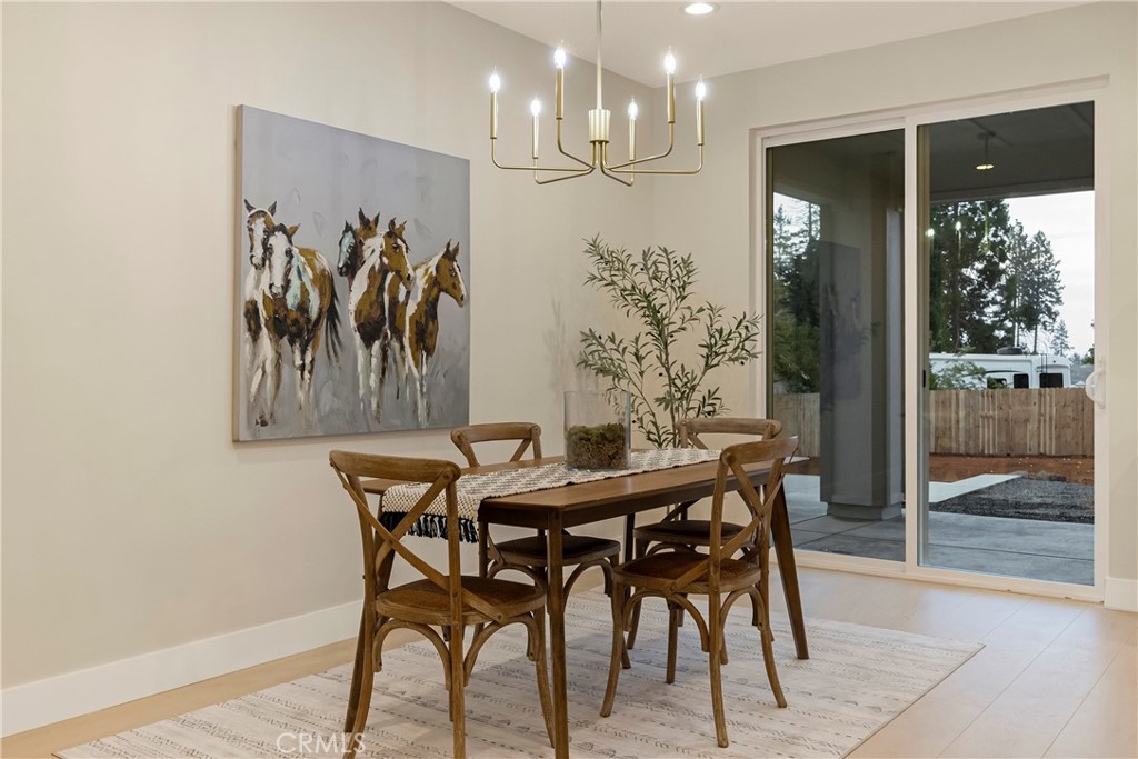 1560 Elliott Road Paradise, CA 95969 - Photo 20 of 50 a view of a dining room with furniture and chandelier
