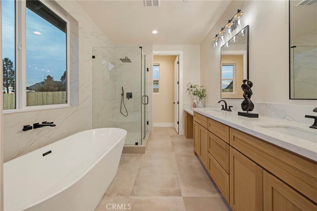1560 Elliott Road Paradise, CA 95969 - Photo 32 of 50 a spacious bathroom with a tub sink a mirror a shower and vanity