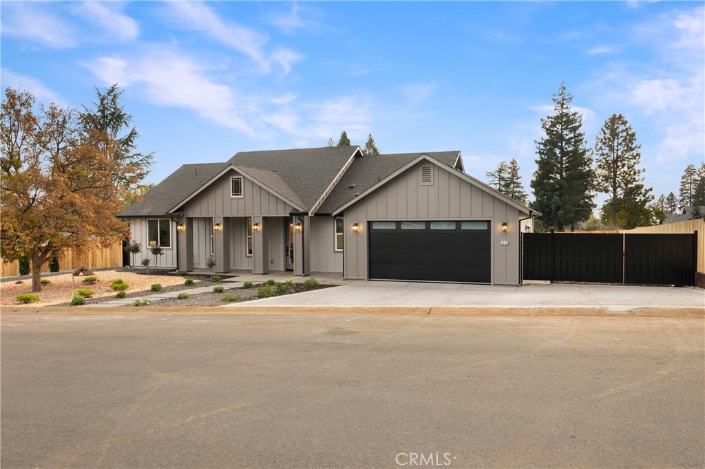1560 Elliott Road Paradise, CA 95969 - Photo 9 of 50 a front view of a house with a yard and garage