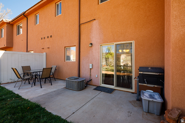 6 300th Road North, Unit I6 Kanab, UT 84741 - Photo 28 of 37 Rear view of property featuring a patio area, outdoor dining space, and stucco siding