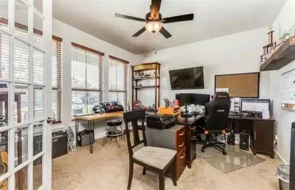 a living room with lots of furniture and a flat screen tv