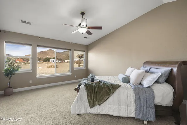 a bed room with a bed and a chandelier