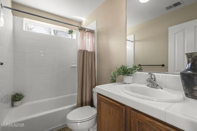 a view of a terrace with outdoor seating and city view