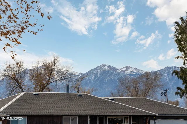 a backyard of a house with large trees