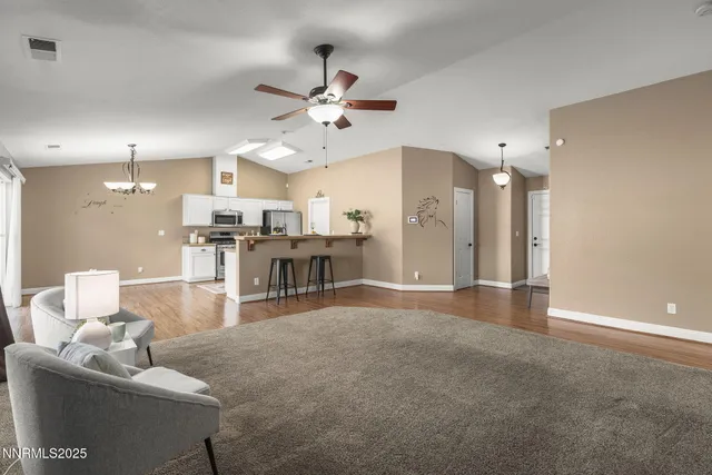 a living room with furniture and a table