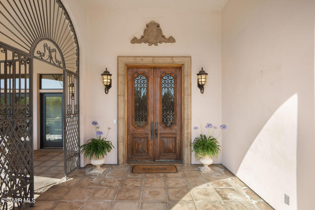 6934 Solano Verde Drive Somis, CA 93066 - Photo 4 of 80 a front view of a house with a yard