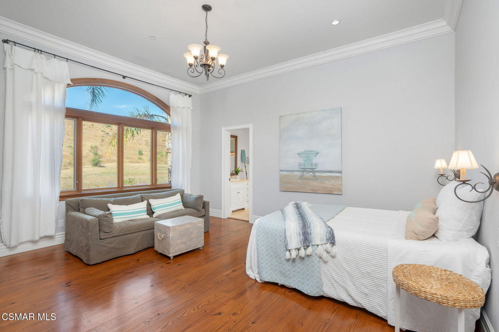 6934 Solano Verde Drive Somis, CA 93066 - Photo 41 of 80 a living room with furniture and a chandelier