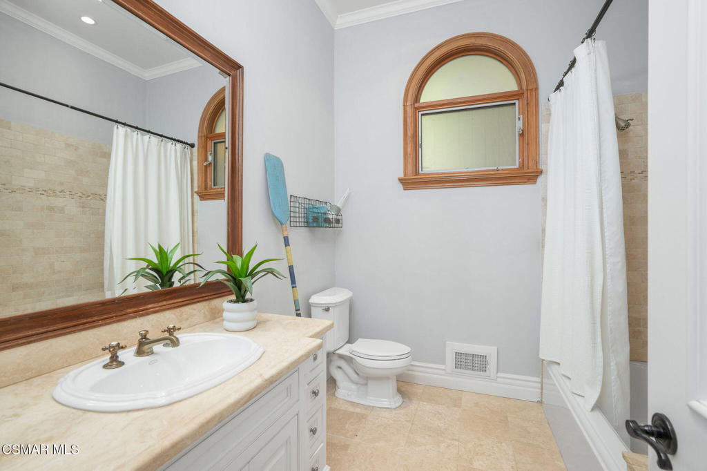 6934 Solano Verde Drive Somis, CA 93066 - Photo 43 of 80 a bathroom with a sink and a mirror