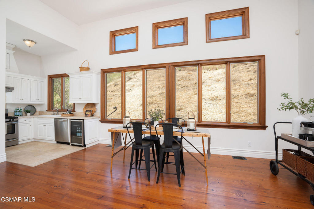 6934 Solano Verde Drive Somis, CA 93066 - Photo 57 of 80 a view of a a dining room with furniture window and wooden floor
