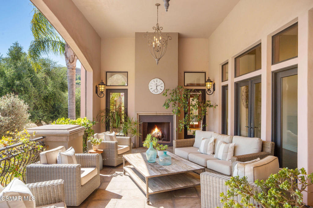 6934 Solano Verde Drive Somis, CA 93066 - Photo 6 of 80 a living room with fireplace furniture and a large window