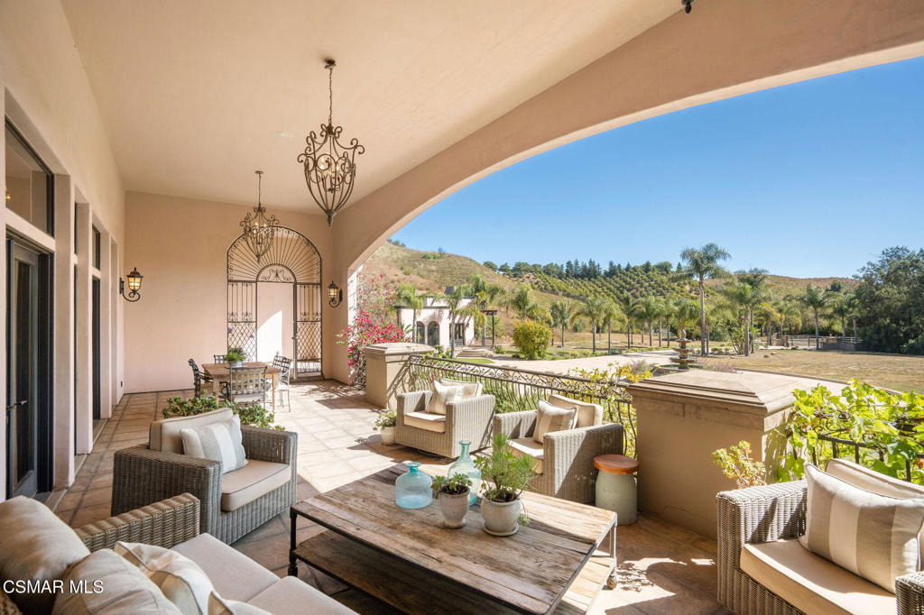 6934 Solano Verde Drive Somis, CA 93066 - Photo 7 of 80 a living room with furniture a rug and a chandelier