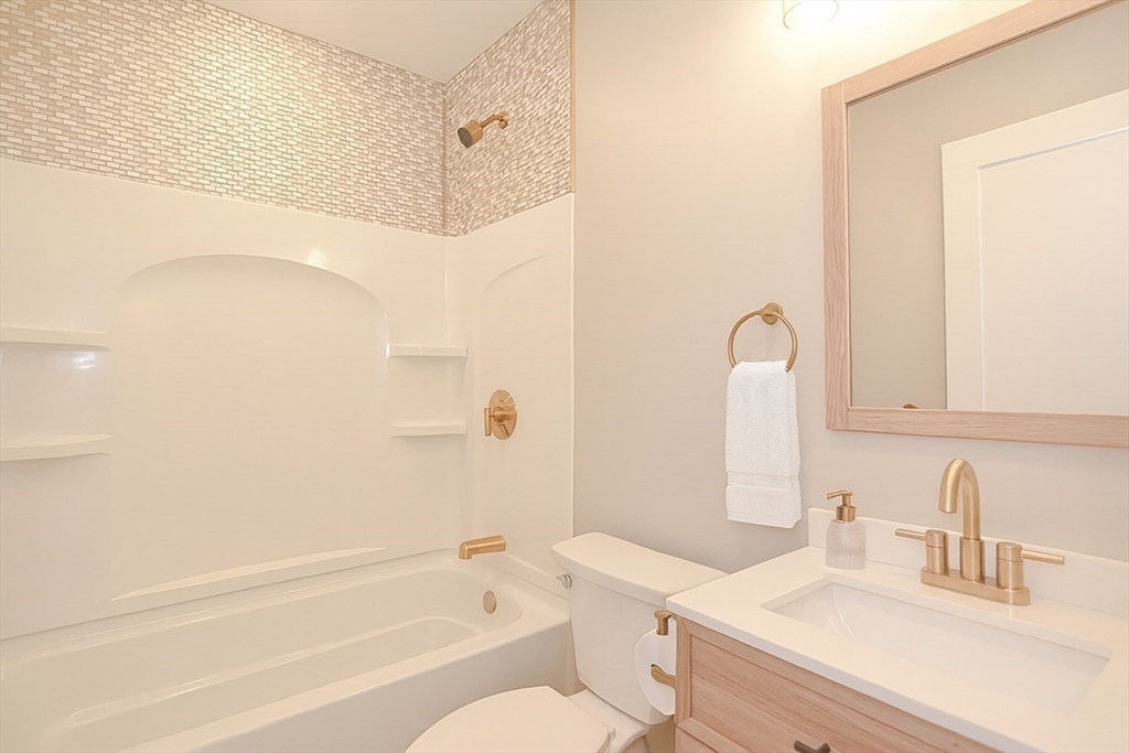 69 Falcon Street, Unit 2 Boston, MA 02128 - Photo 11 of 13 a bathroom with a sink a toilet and a bathtub