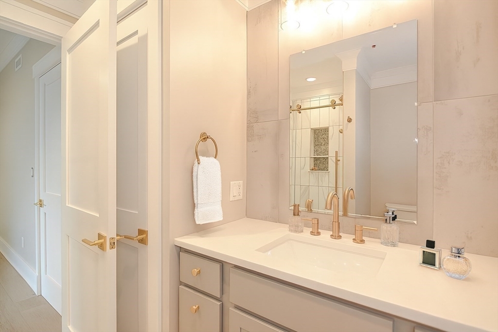 69 Falcon Street, Unit 2 Boston, MA 02128 - Photo 6 of 13 a bathroom with a sink and a mirror