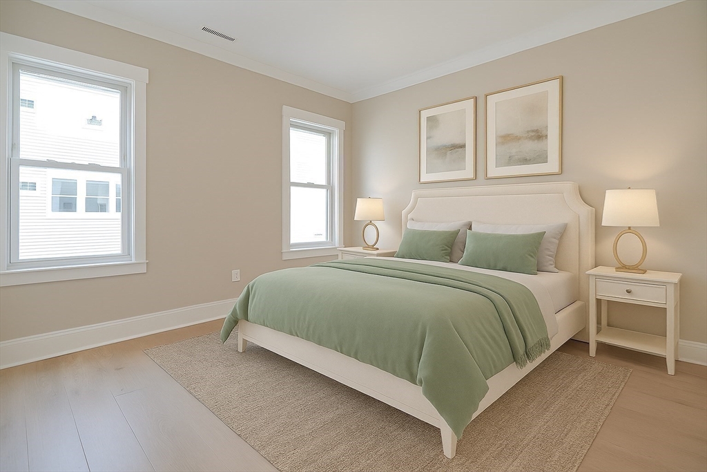 69 Falcon Street, Unit 2 Boston, MA 02128 - Photo 8 of 13 a bedroom with a bed and window