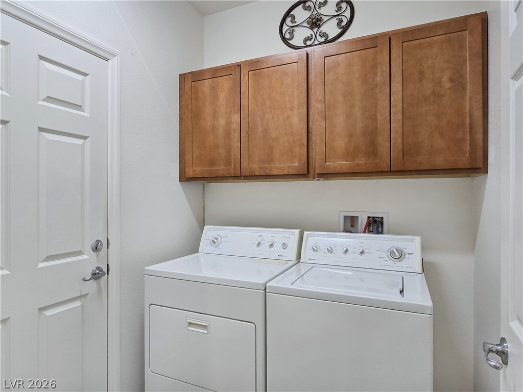 2485 Morrow Ridge Place Laughlin, NV 89029 - Photo 27 of 40 Functional laundry space featuring convenient overhead cabinetry for organization.
