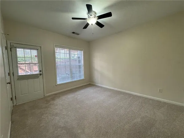 a view of an empty room with a window