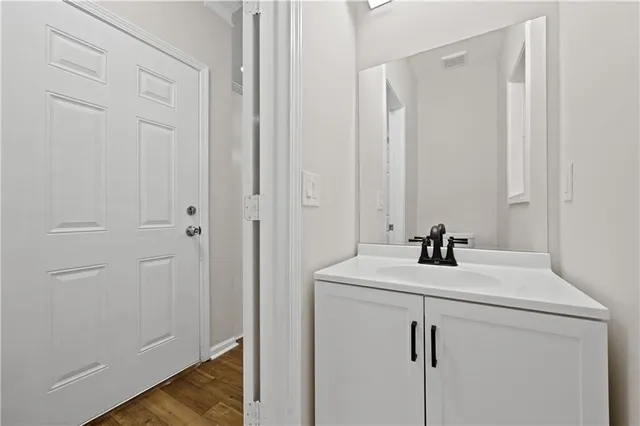 a bathroom with a sink and vanity