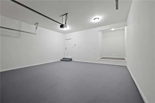 an empty room with a ceiling fan and wooden floor