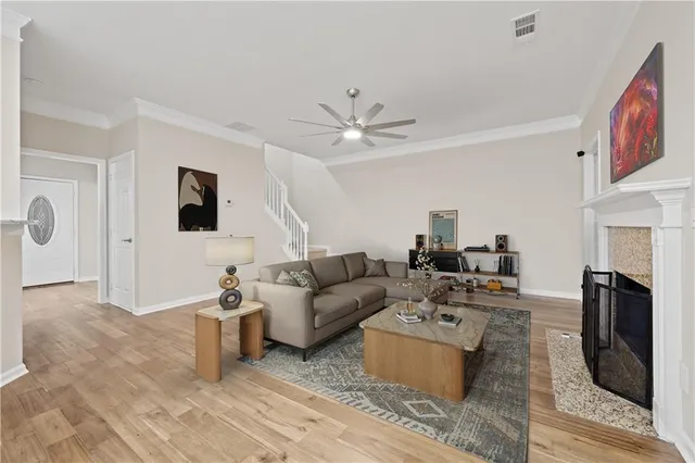 a living room with furniture and a fireplace
