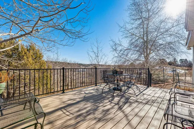 a view of a balcony with chairs