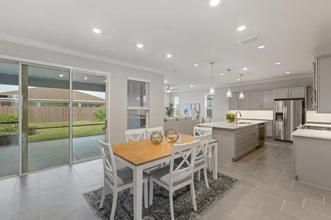 a kitchen with a table and chairs in it