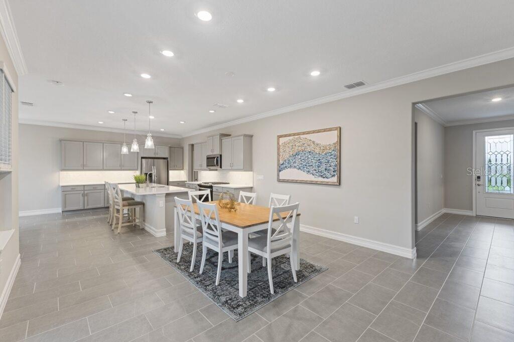 5567 Northwest 45th Lane Ocala, FL 34482 - Photo 12 of 21 a view of a dining room with furniture